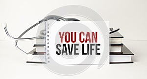 You can save life word on notebook, stethoscope and books