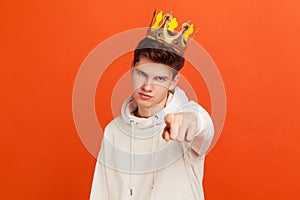 You can! Self confident egoistic man in casual hoodie with golden crown on head pointing finger on you looking at camera,