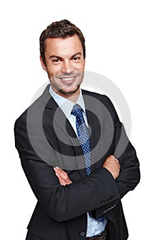 You can trust his financial advice. A handsome young businessman crossing his arms while isolated on a white background.