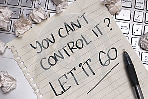 You cant control it let go, text words typography written on paper, life and business motivational inspirational