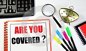 Are you covered? An inscription in the planning folder, against the background of a time control clock,