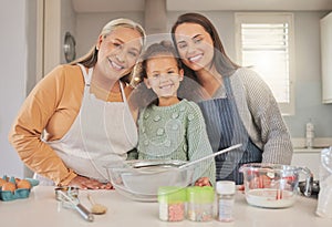 When you crave something sweet, well whisk it up. Shot of a little girl baking with her mother and grandmother at home.