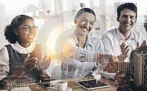 You deserve it. a group of young businesspeople applauding while sitting in the conference room during a seminar.