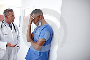 You did everything you could. Shot of a doctor and a surgeon having a difficult conversation.
