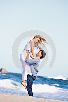 You fill my life with joy. a happy young couple enjoying a romantic day on the beach.