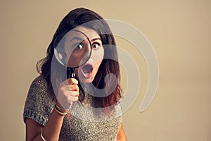 When you finally find what youve been stalking for. Studio portrait of a young woman looking shocked while using a