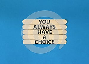 You always have choice symbol. Concept words You always have a choice on wooden stick. Beautiful blue table blue background.