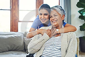 You have done so much for my family and I. Portrait of a cheerful young female nurse holding a elderly patient in a