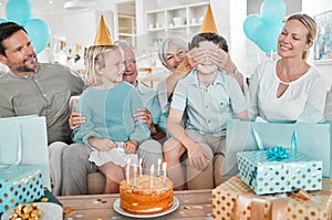 You have to guess. a happy family celebrating a birthday together at home.