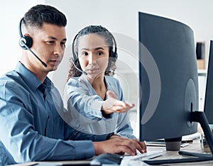 You have to know the ins and outs of your companys offerings. two call centre agents working together on a computer in