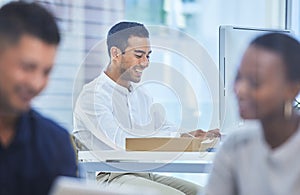 You have to outwork those around you to become the best. Defocused shot of a businessman looking happy while sitting at