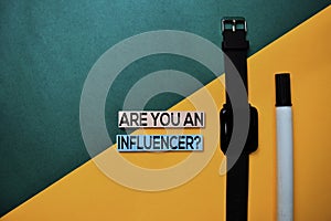 Are You An Influencer? text on top view color table background