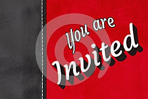 You are Invited type message on red plush material