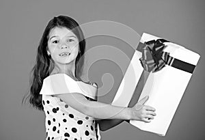 This is for you. little girl carry present. big christmas sale. kid hold gift box. boxing day concept. dreams come true