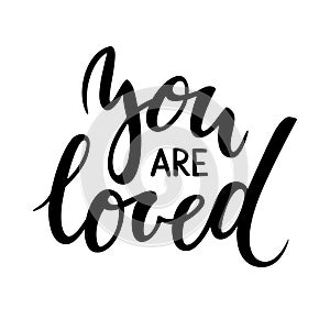 You are loved. Hand drawn creative calligraphy and brush pen lettering photo