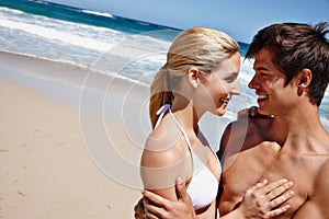 You make this moment perfect. a happy young couple enjoying a romantic day on the beach.