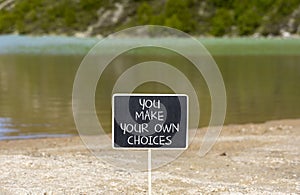 You make your own choice symbol. Concept words You make your own choice on beautiful blackboard. Beautiful mountain lake