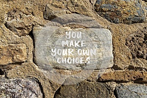 You make your own choice symbol. Concept words You make your own choice on beautiful stone. Beautiful stone wall background.