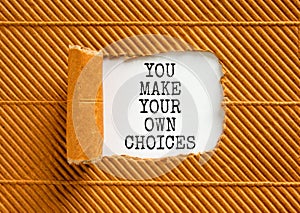 You make your own choice symbol. Concept words You make your own choice on beautiful white paper. Beautiful brown paper background