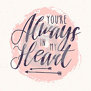You Are Always In My Heart lettering or love confession written with calligraphic font against pink round paint stain on