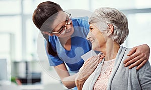 You are my number one priority. a young female nurse talking to her senior patient in the old age home.