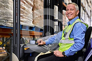 You need to think beyond your competitor. Shot of a mature man working on a forklift in a warehouse.