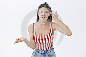 You out of your mind or sick. Portrait of irritated and annoyed fed up girlfriend in stylish striped top and headband