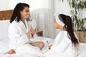 You`re Beautiful. Loving Black Mom Showing Mirror To Her Cute Little Daughter