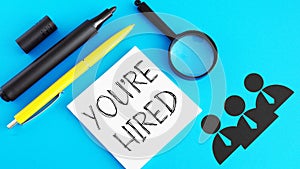 You're hired is shown using the text