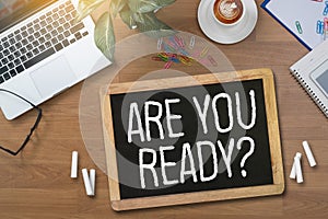 ARE YOU READY? Businessman work hard desktop with laptop, photo