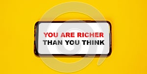 YOU ARE RICHER THAN YOU THINK - motivating words on the phone screen