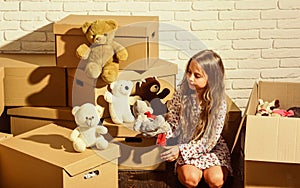 You are sure to love it. Cardboard boxes - moving to new house. happy child cardboard box. happy little girl with toy