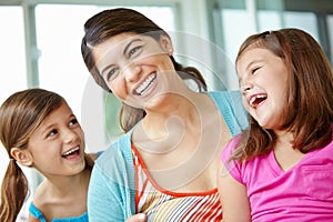 You two are so funny. A young mother spending some quality time with her two daughters.