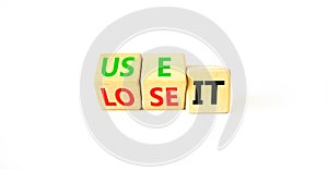 You use or lose it symbol. Concept word Use It or lose it on wooden cubes. Beautiful white table white background. Business and