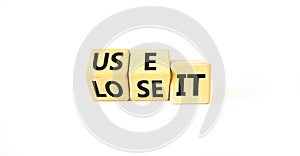 You use or lose it symbol. Concept word Use It or lose it on wooden cubes. Beautiful white table white background. Business and