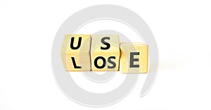 You use or lose it symbol. Concept word Use or lose on wooden cubes. Beautiful white table white background. Business and you use