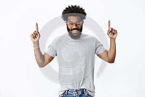 You wanna see it. Portrait of enthusiastic attractive happy young african american masculine man with curly hair