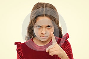You are warned. Girl kid threatening with fist isolated on white. Strong temper. Threatening with physical attack. Kids photo