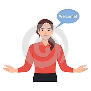 You are welcome. Cheerful woman gesturing welcome sign and smiling while standing