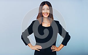 You were made to achieve greatness. Studio shot of a confident young businesswoman posing against a grey background.