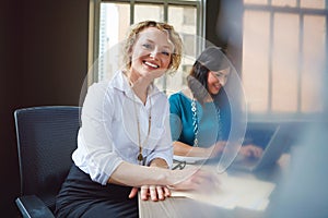 You wont find a more productive team. Portrait of two businesswomen having a meeting together in an office.