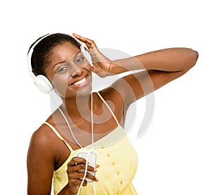 Youd be smiling too if you heard this sound. Studio shot of a young woman using headphones and a smartphone against a