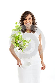 Youg woman jumping with healthy salad