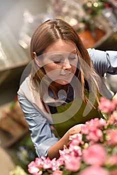 Youg woman working in flower shop