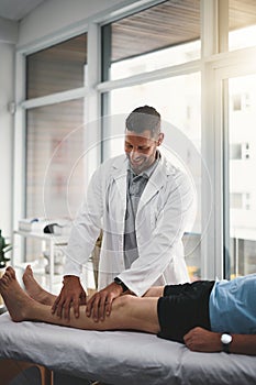 Youll be healed in no time. a young male physiotherapist assisting a senior patient in recovery.