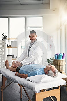 Youll be up on your feet again in no time. a young male physiotherapist assisting a senior patient in recovery.