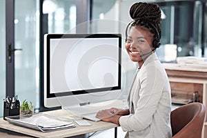 Youll find lots more info on our website. Portrait of a young call centre agent working on a computer in an office.