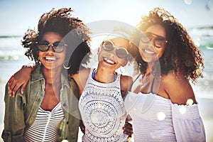 Youll always find us out having a fun time. three friends enjoying themselves at the beach on a sunny day.