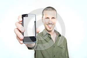 Youn man showing a smart phone