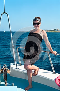 Youn woman on yacht board